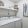 large laundry room with ample lighting and built-in shelf